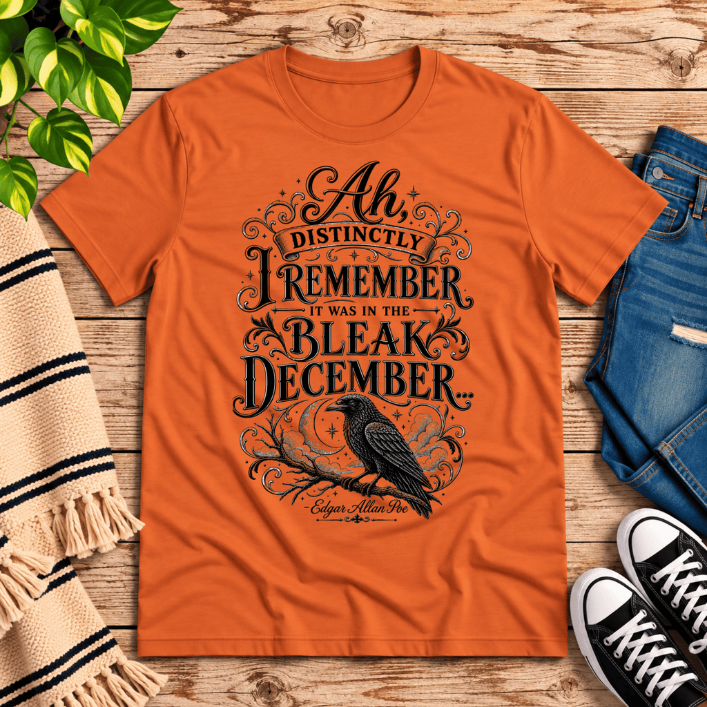 Bleak December book quote graphic t-shirt cozy flat lay in burnt orange.
