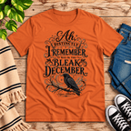 Bleak December book quote graphic t-shirt cozy flat lay in burnt orange.
