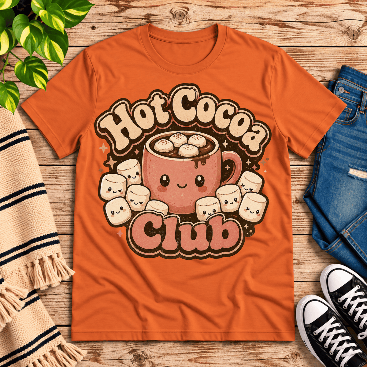 Hot Cocoa Club cute coffee graphic t-shirt cozy flat lay in burnt orange.