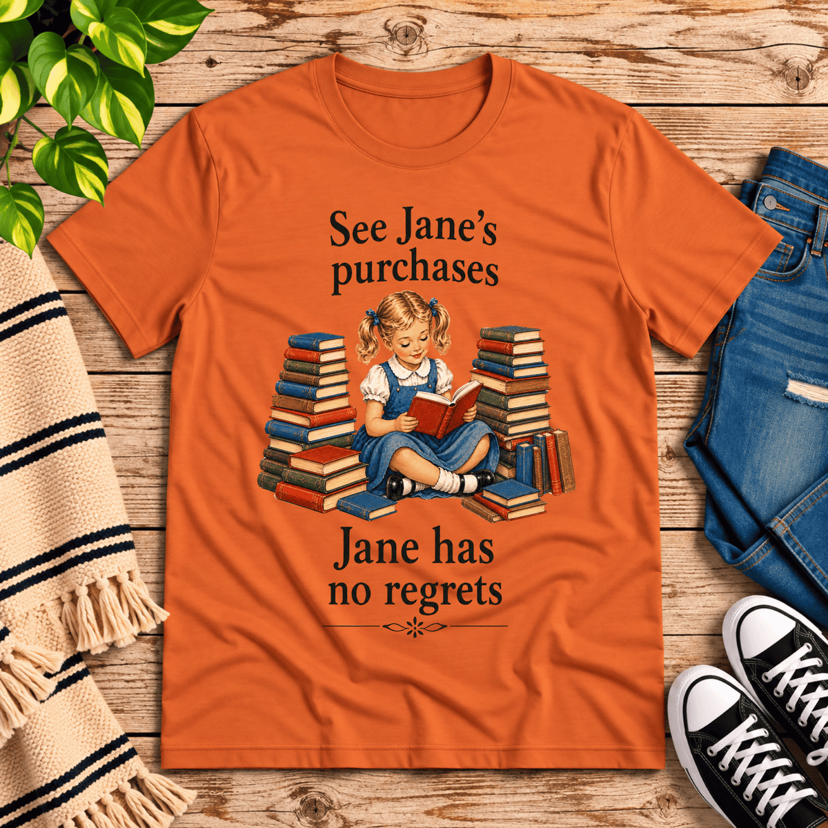 See Jane's Purchases vintage book graphic t-shirt cozy flat lay in burnt orange.