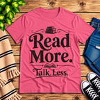 Talk Less funny book graphic t-shirt cozy flat lay in charity pink.