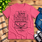 Love Knows Not book quote graphic t-shirt cozy flat lay in charity pink.