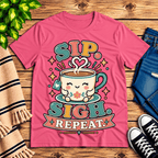Sip. Sigh. Repeat. coffee graphic t-shirt cozy flat lay in charity pink.