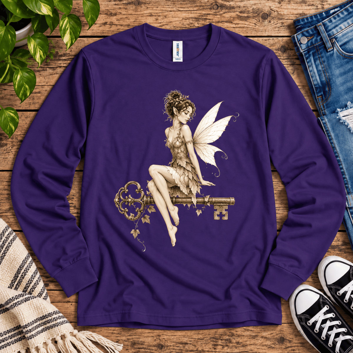 Fairy Key cute pinup graphic long sleeve t-shirt cozy flat lay in deep purple.