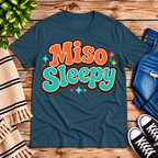 Miso Sleepy funny food graphic t-shirt cozy flat lay in deep teal.