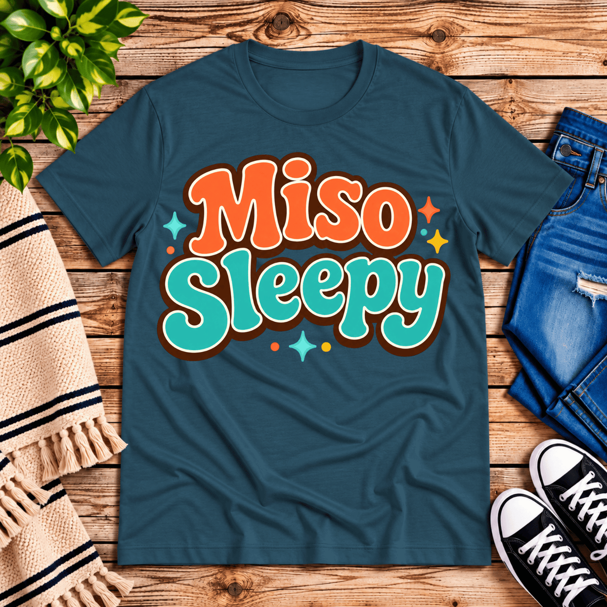 Miso Sleepy funny food graphic t-shirt cozy flat lay in deep teal.