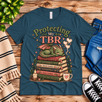 Protecting My TBR cute book graphic t-shirt cozy flat lay in deep teal.