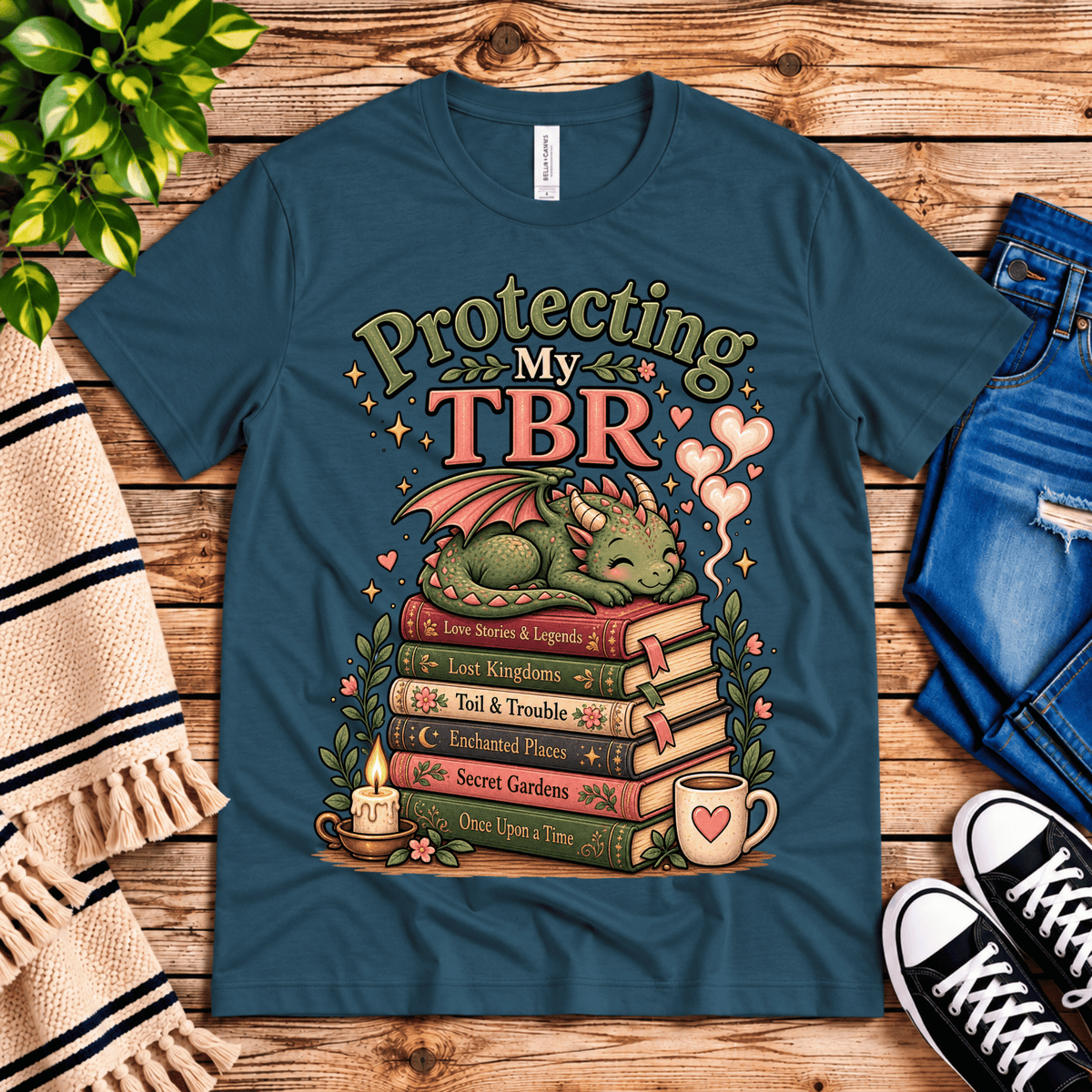 Protecting My TBR cute book graphic t-shirt cozy flat lay in deep teal.