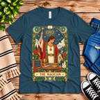 The Magician tarot card graphic t-shirt cozy flat lay in deep teal.