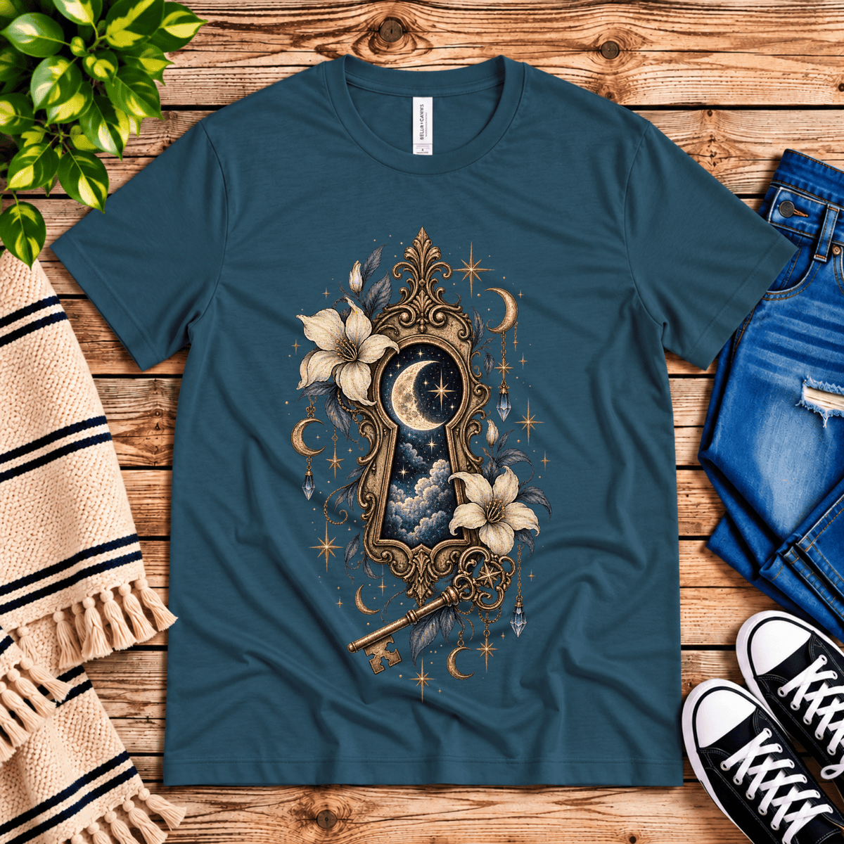 Cosmos Keyhole celestial graphic t-shirt cozy flat lay in deep teal.