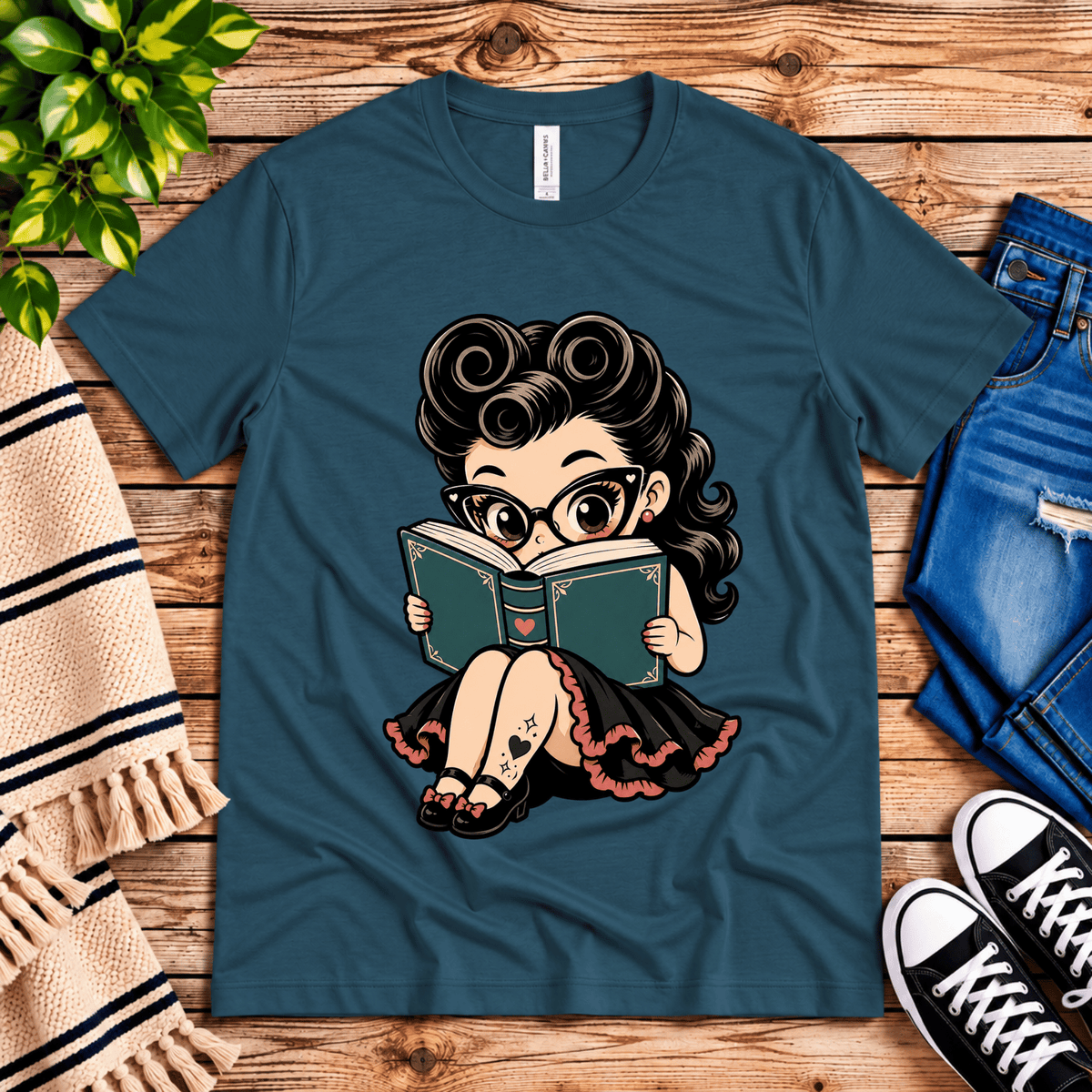 Bookworm Betty pinup graphic t-shirt cozy flat lay in deep teal.