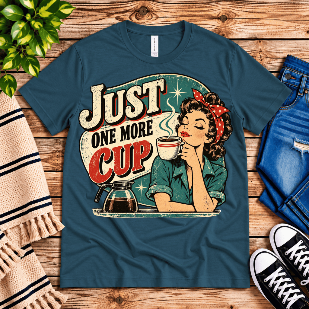 Just One More retro coffee graphic t-shirt cozy flat lay in deep teal.
