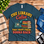 The Library Called book lovers graphic t-shirt cozy flat lay in deep teal.