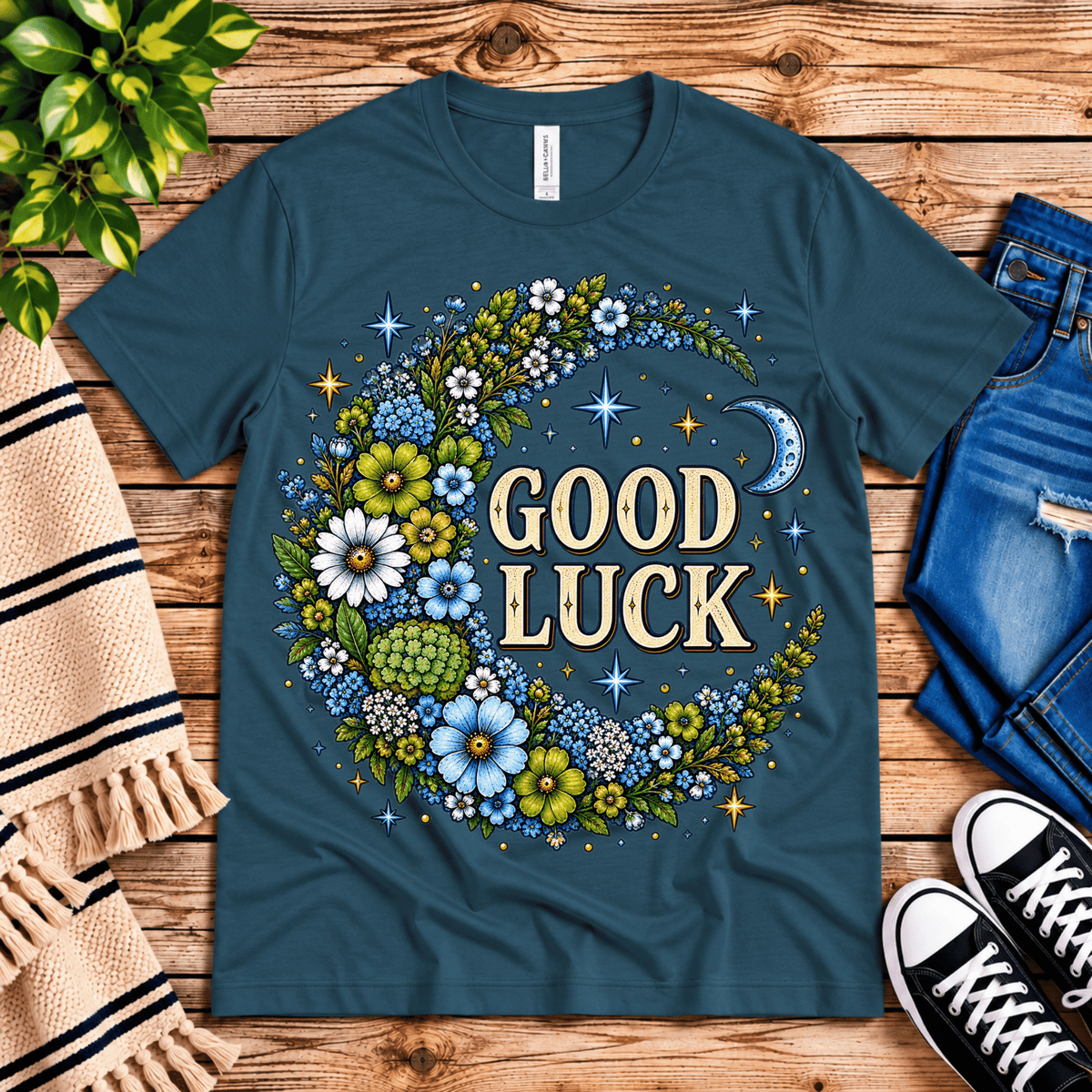 Good Luck In Blue cute celestial graphic t-shirt cozy flat lay in deep teal.