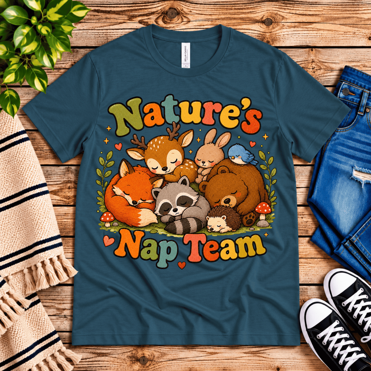 Nature's Nap Team cute animal graphic t-shirt cozy flat lay in deep teal.