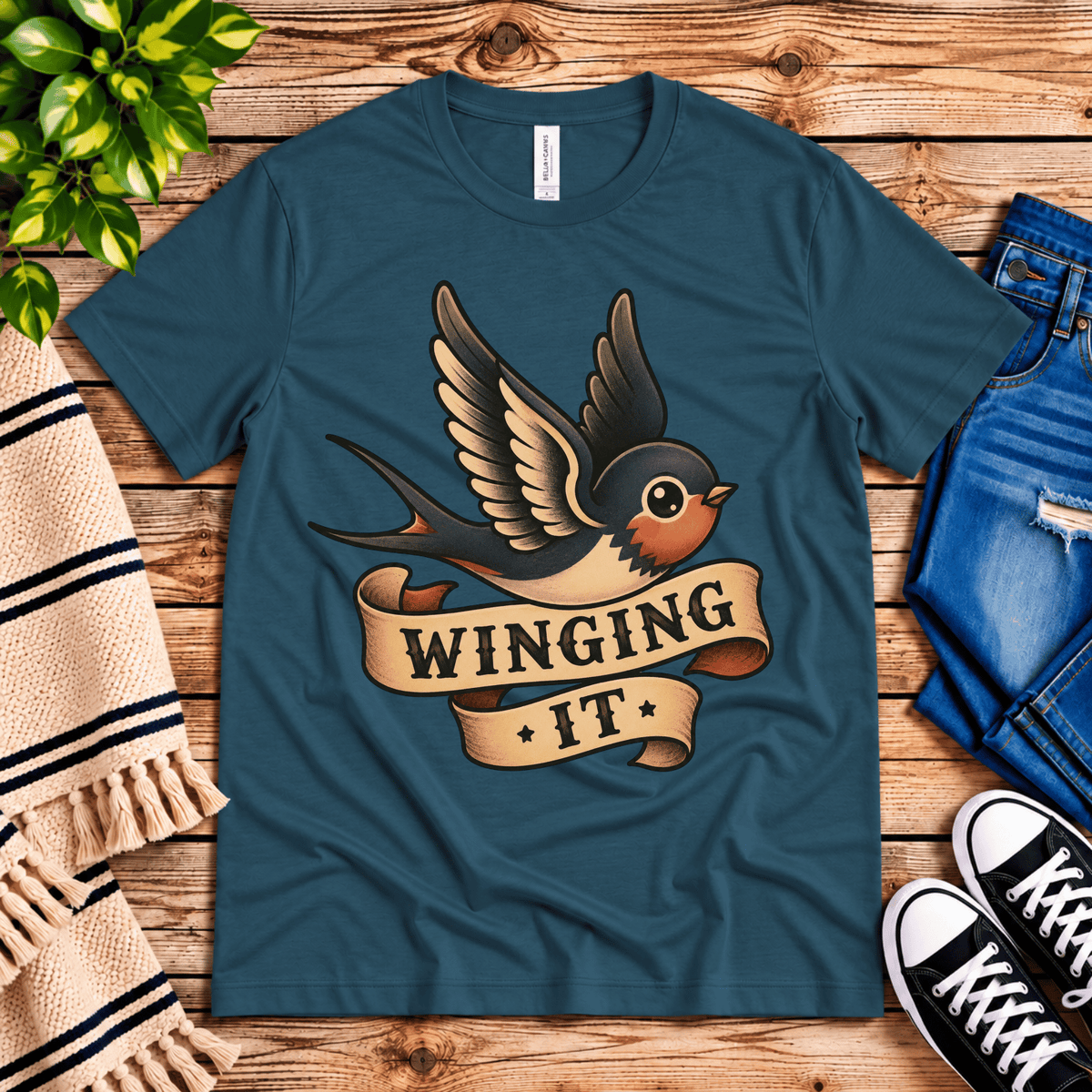 Winging It cute animal graphic t-shirt cozy flat lay in deep teal.