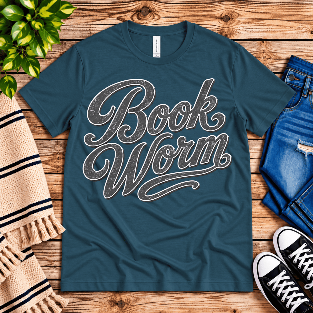 Book Worm book lover graphic t-shirt cozy flat lay in deep teal.