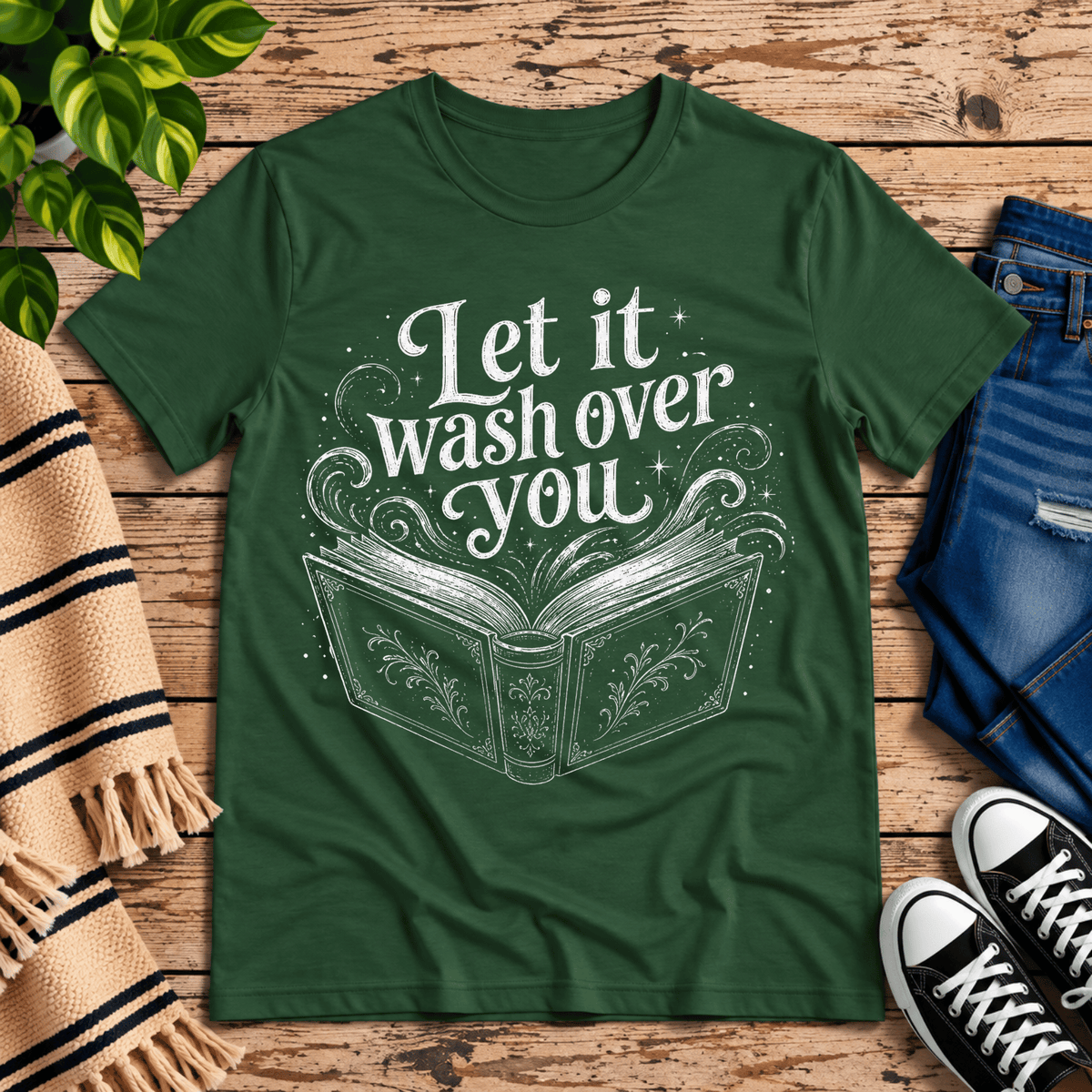 Let It Wash Over You whimsical book graphic t-shirt cozy flat lay in evergreen.
