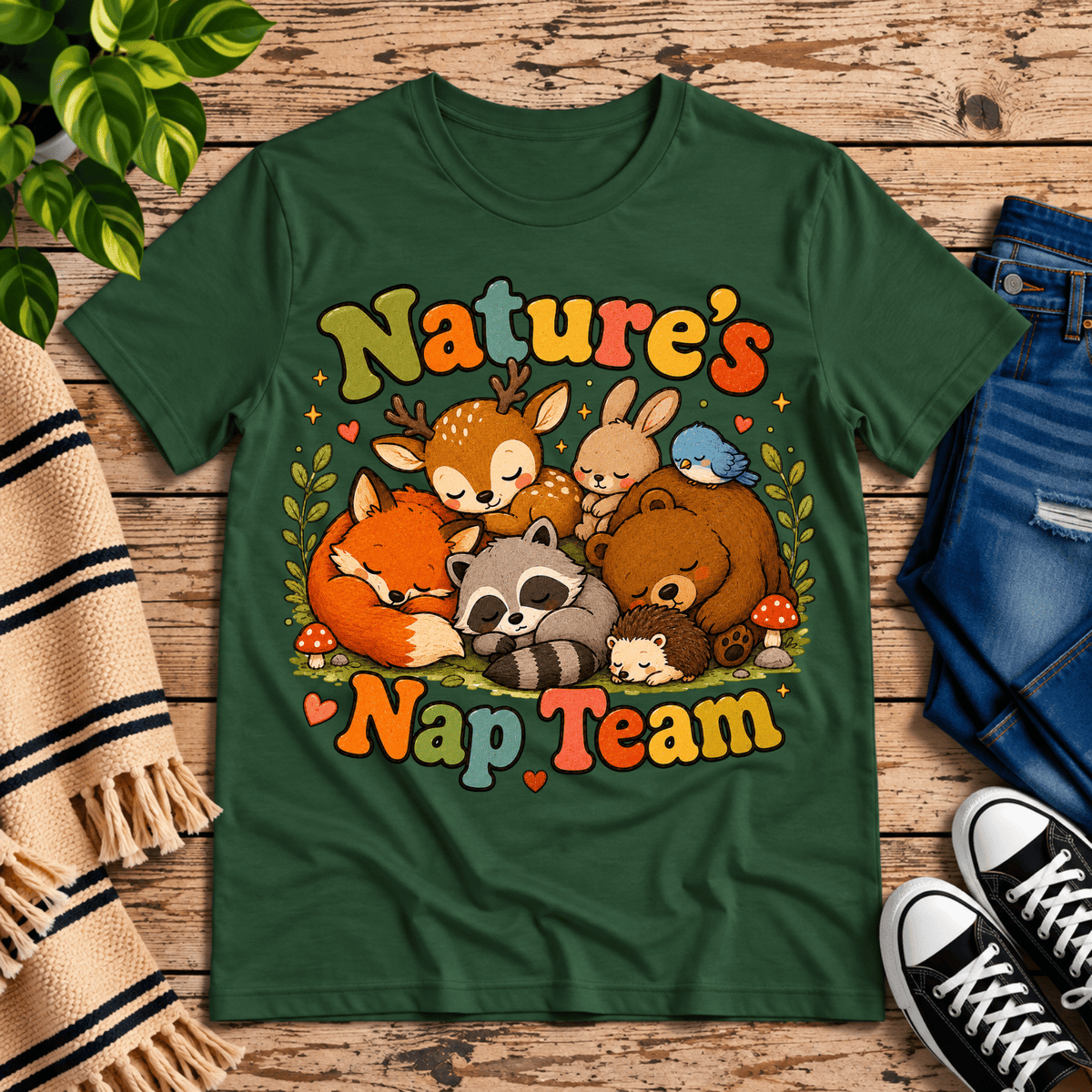 Nature's Nap Team cute animal graphic t-shirt cozy flat lay in evergreen.