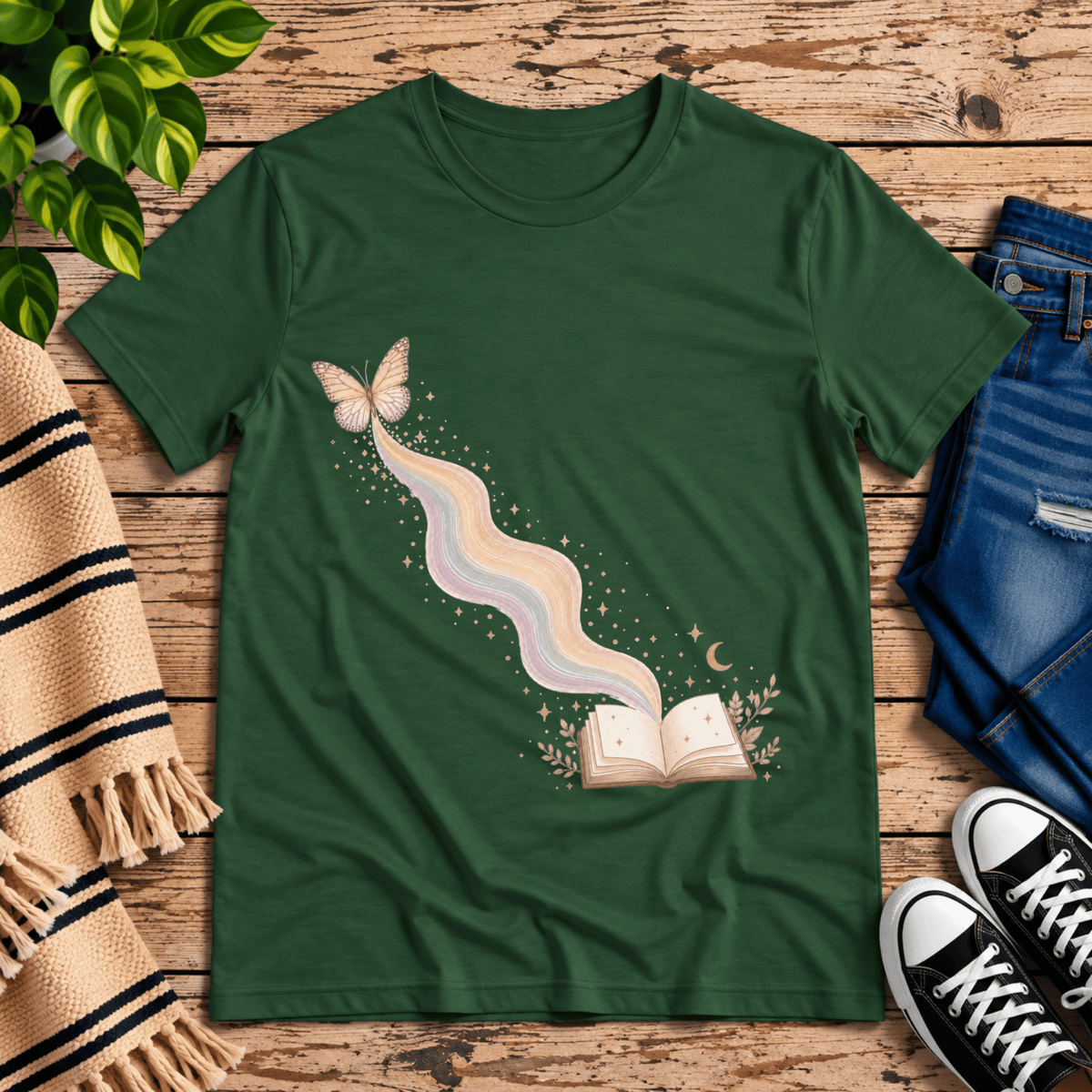 Rainbow Book whimsical book graphic t-shirt cozy flat lay in evergreen.