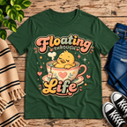 Floating Through Life cute animal graphic t-shirt cozy flat lay in evergreen.