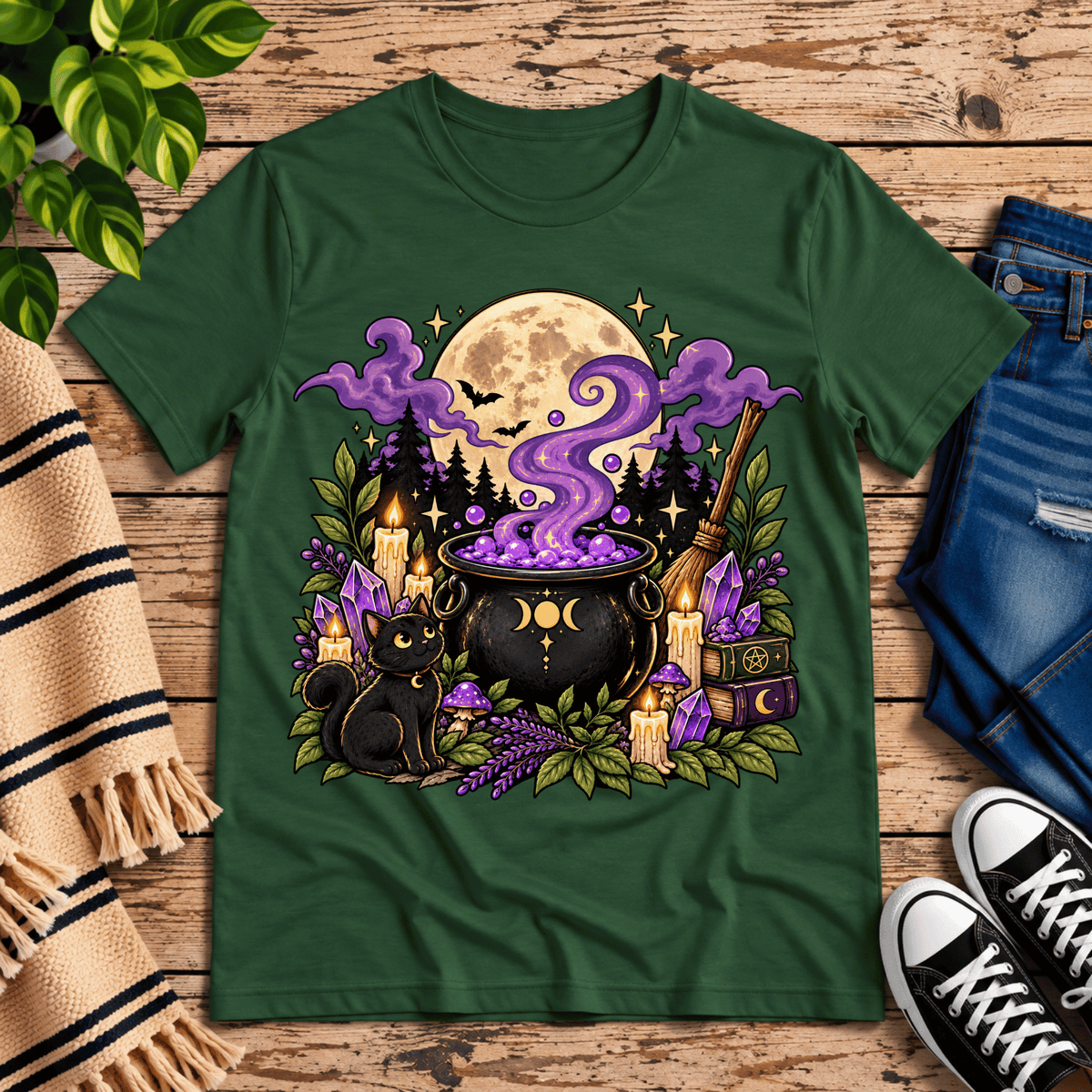 The cauldron cute celestial graphic t-shirt cozy flat lay in evergreen.