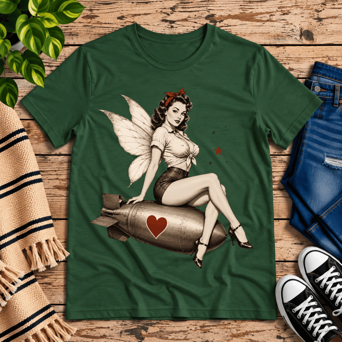 Love Bomb vintage pinup graphic t-shirt cozy flat lay in evergreen.