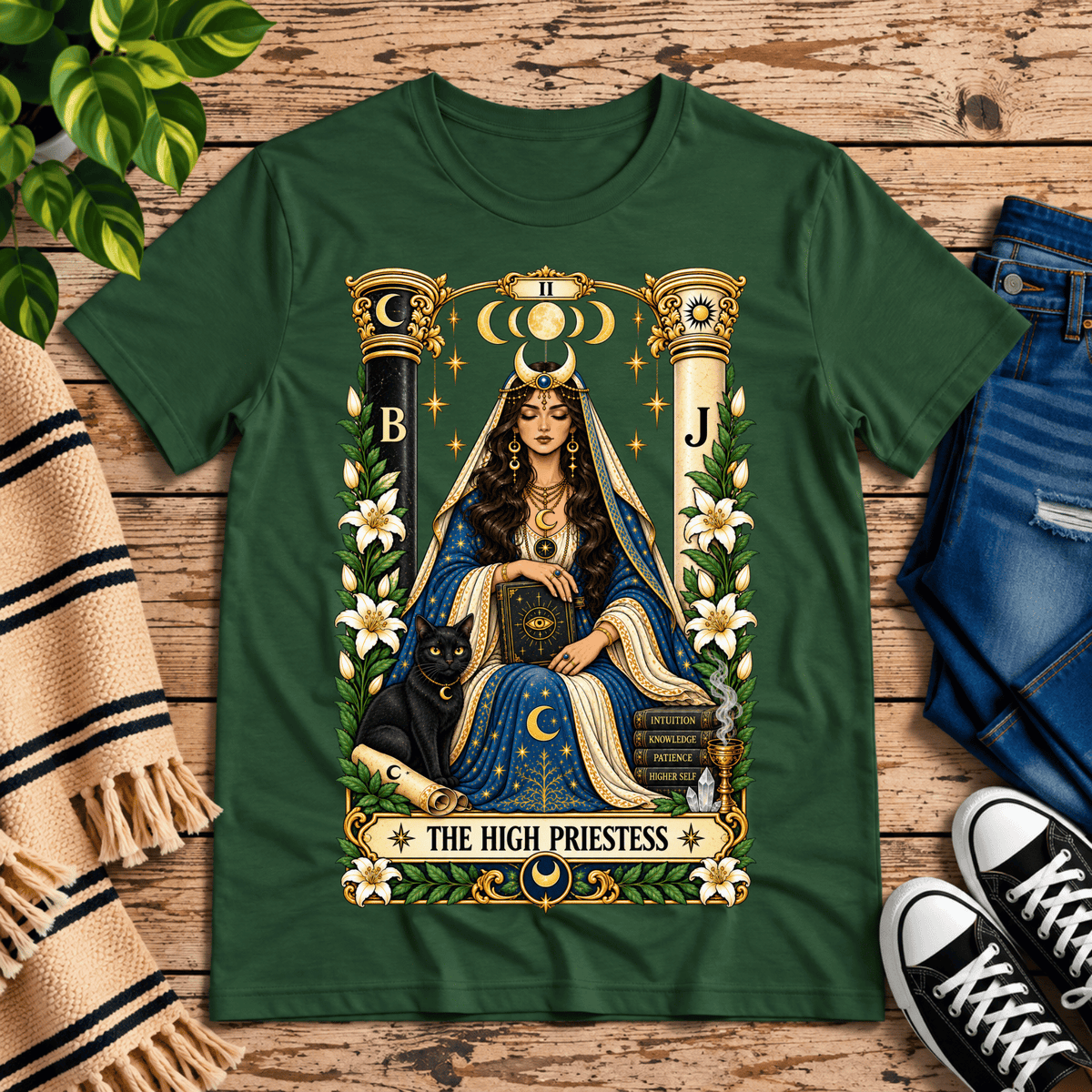 The High Priestess tarot card graphic t-shirt cozy flat lay in evergreen.