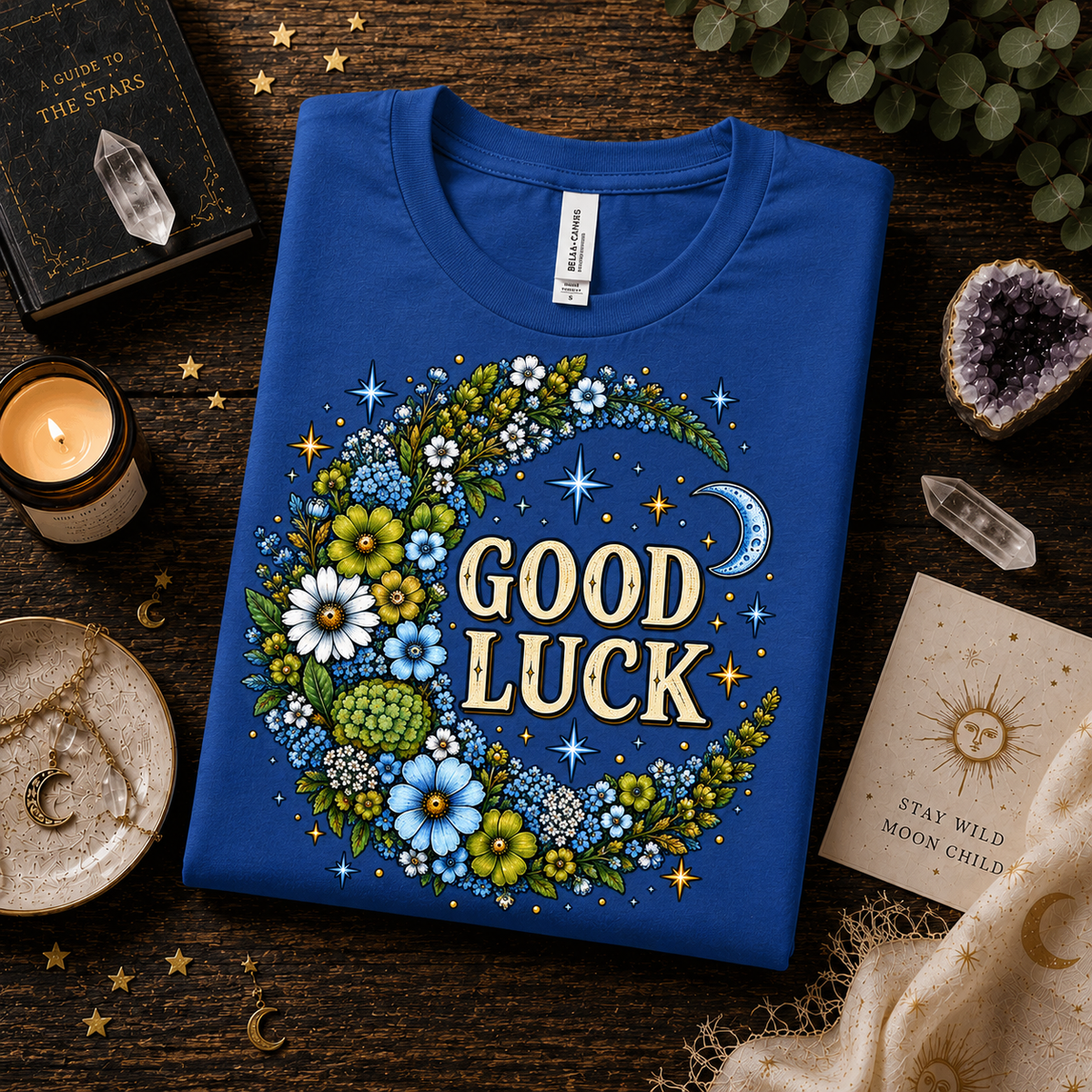 A folded mockup of Good Luck In Blue cute celestial graphic t-shirt in true royal.