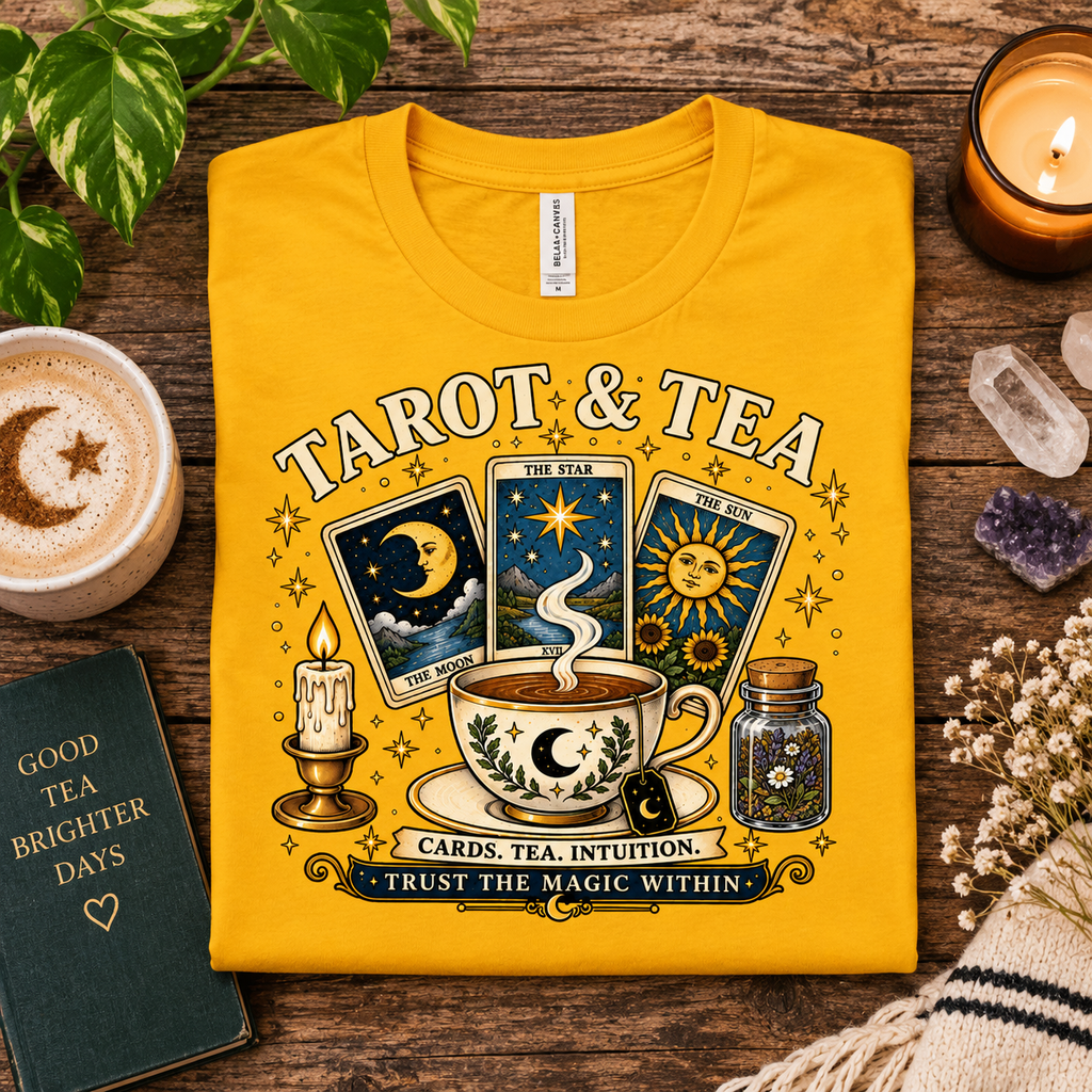 A folded mockup of Tarot & Tea tarot card graphic t-shirt in gold.