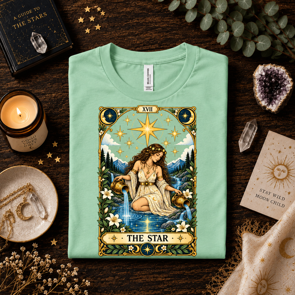 A folded mockup of The Star tarot card graphic t-shirt in mint.