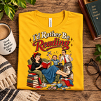 A folded mockup of I'd Rather be retro book graphic t-shirt in gold.