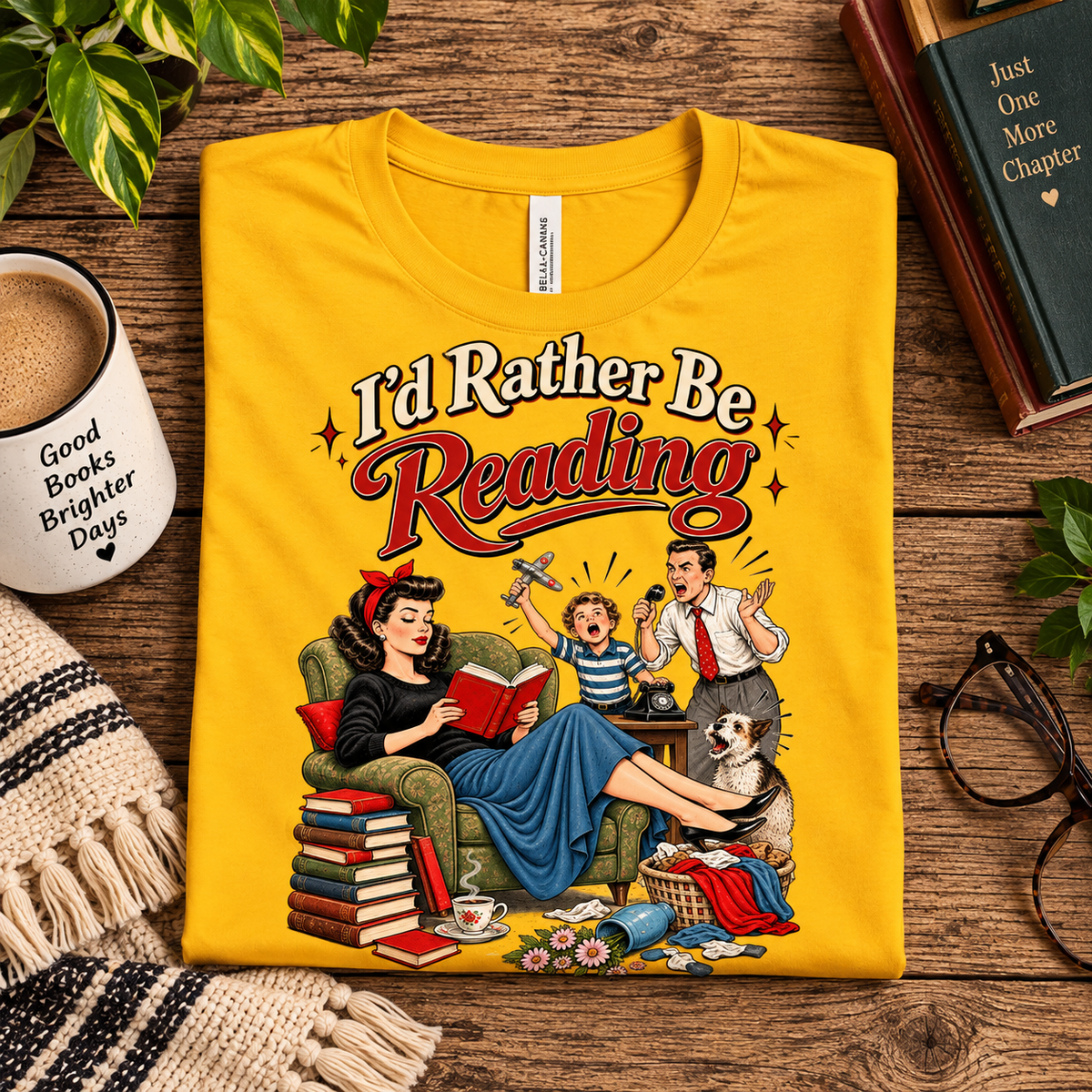 A folded mockup of I'd Rather be retro book graphic t-shirt in gold.