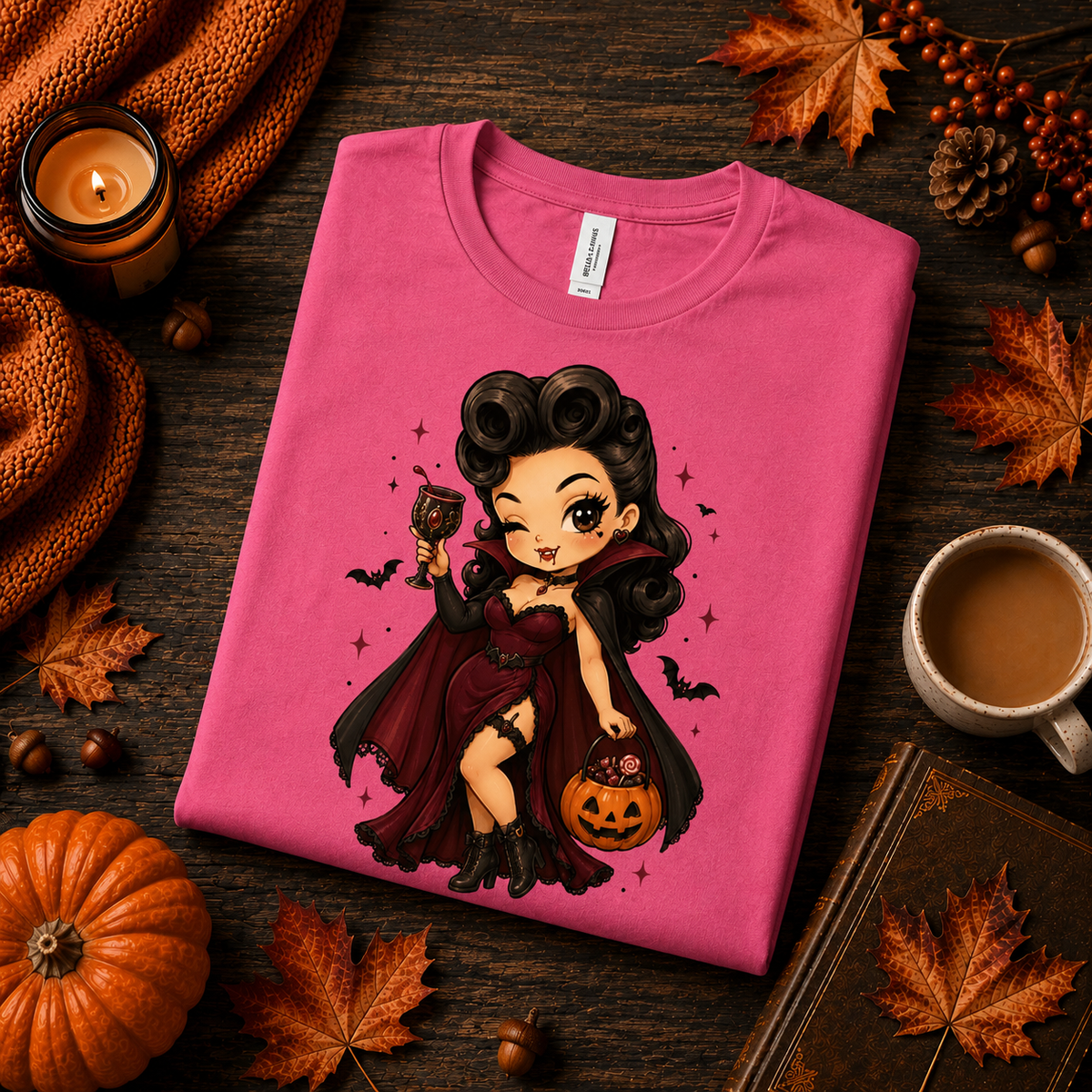 A folded mockup of Vampire Vanessa halloween pinup graphic t-shirt in charity pink.
