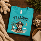 A folded mockup of Treasure Hunter Club cute animal graphic t-shirt in heather sea green.