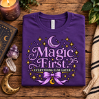 A folded mockup of Magic First whimsical celestial graphic t-shirt in team purple.