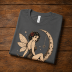 An asphalt Red Rose Moon pinup fairy graphic t-shirt in a folded mockup.
