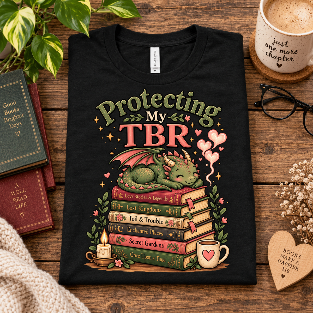 A folded mock up of Protecting my TBR cute book graphic t-shirt in vintage black.