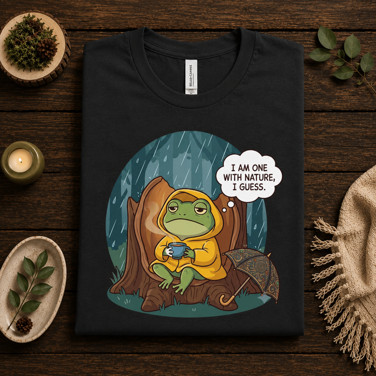 A folded mockup of One With Nature funny nature graphic t-shirt in vintage black.