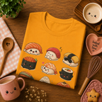 Folded mock up of Sushi graphic t-shirt in gold, surrounded by small kitchen utensils.