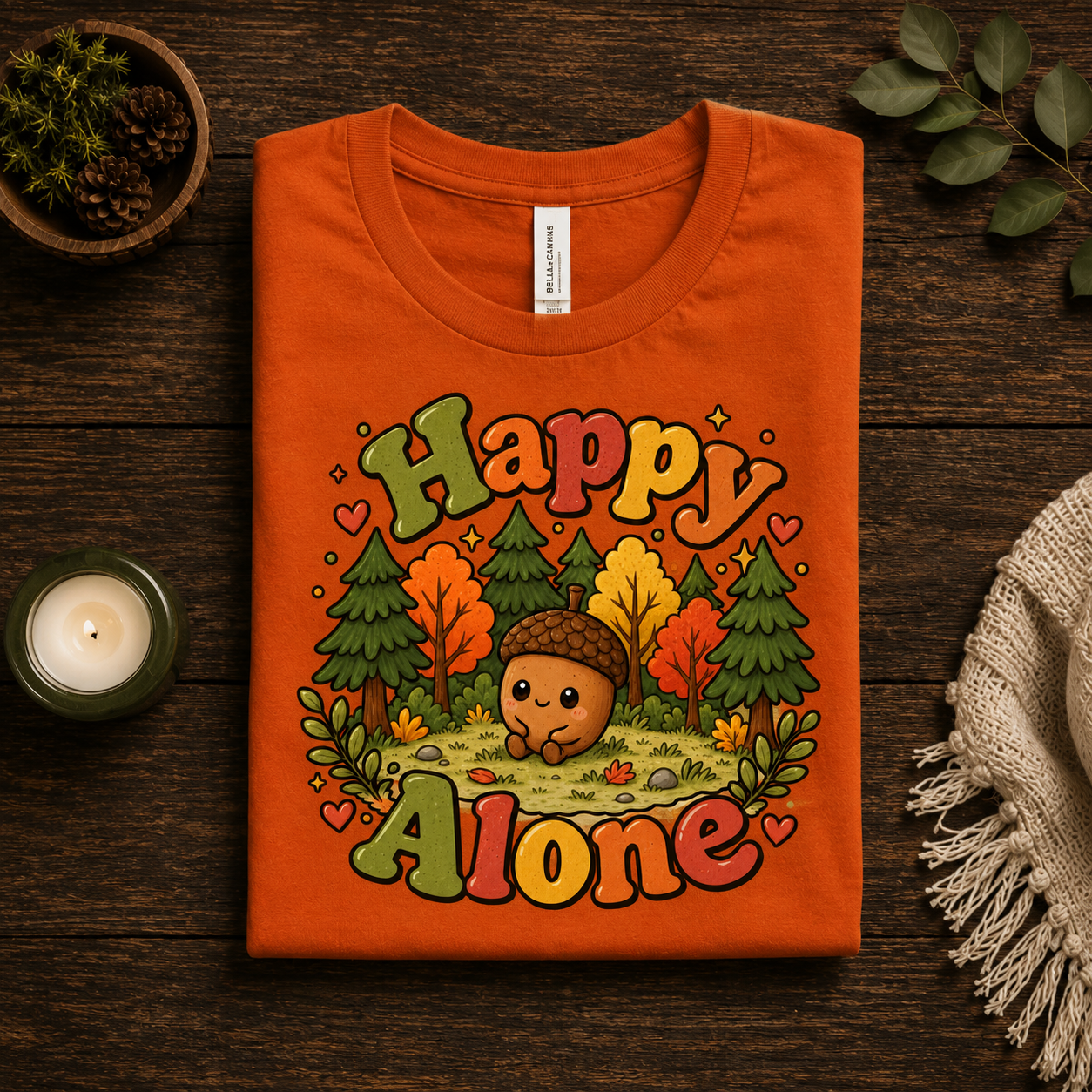 A folded mockup of Happy Alone cute nature graphic t-shirt in burnt orange.