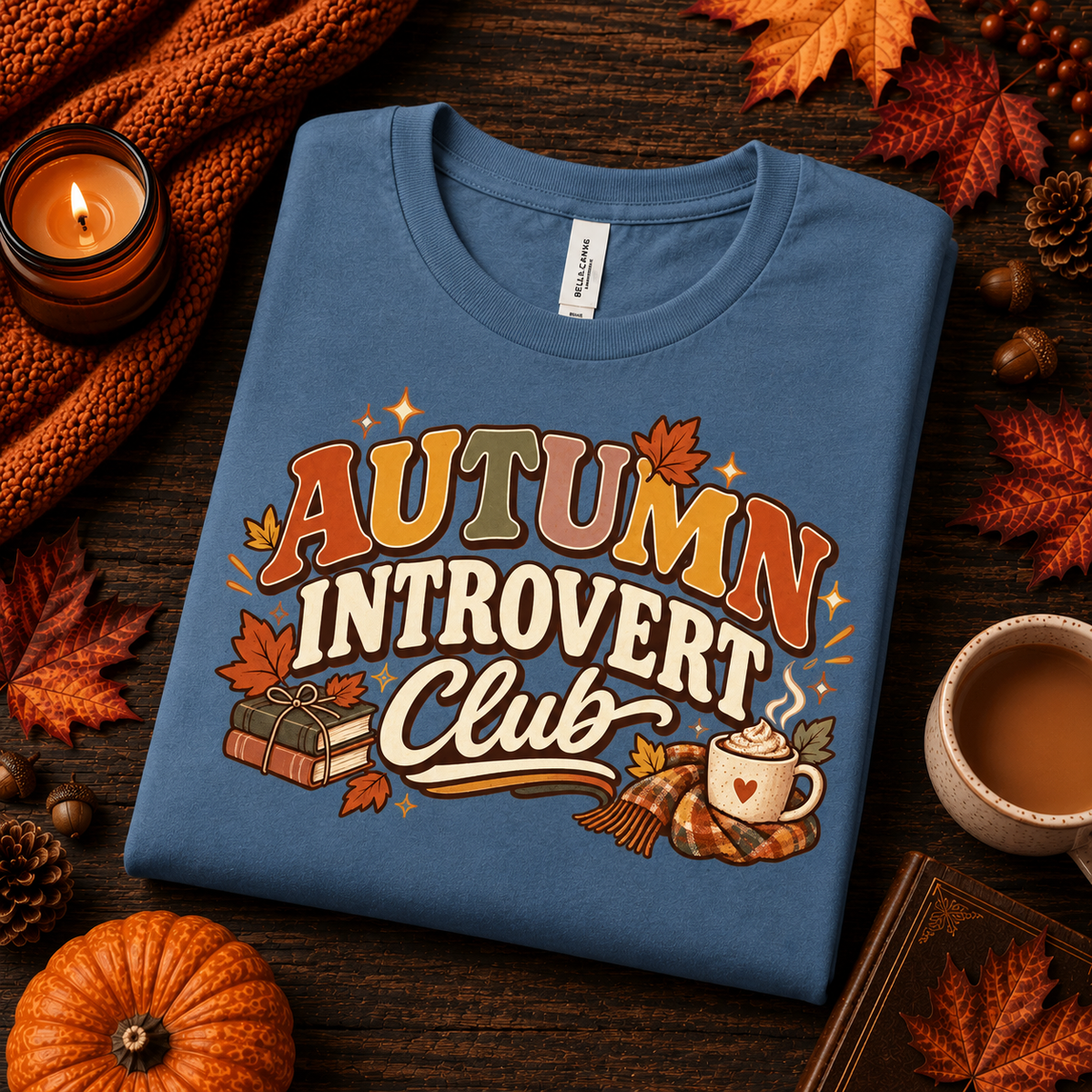 A folded mockup of Autumn Introvert Club cute fall graphic t-shirt in steel blue.