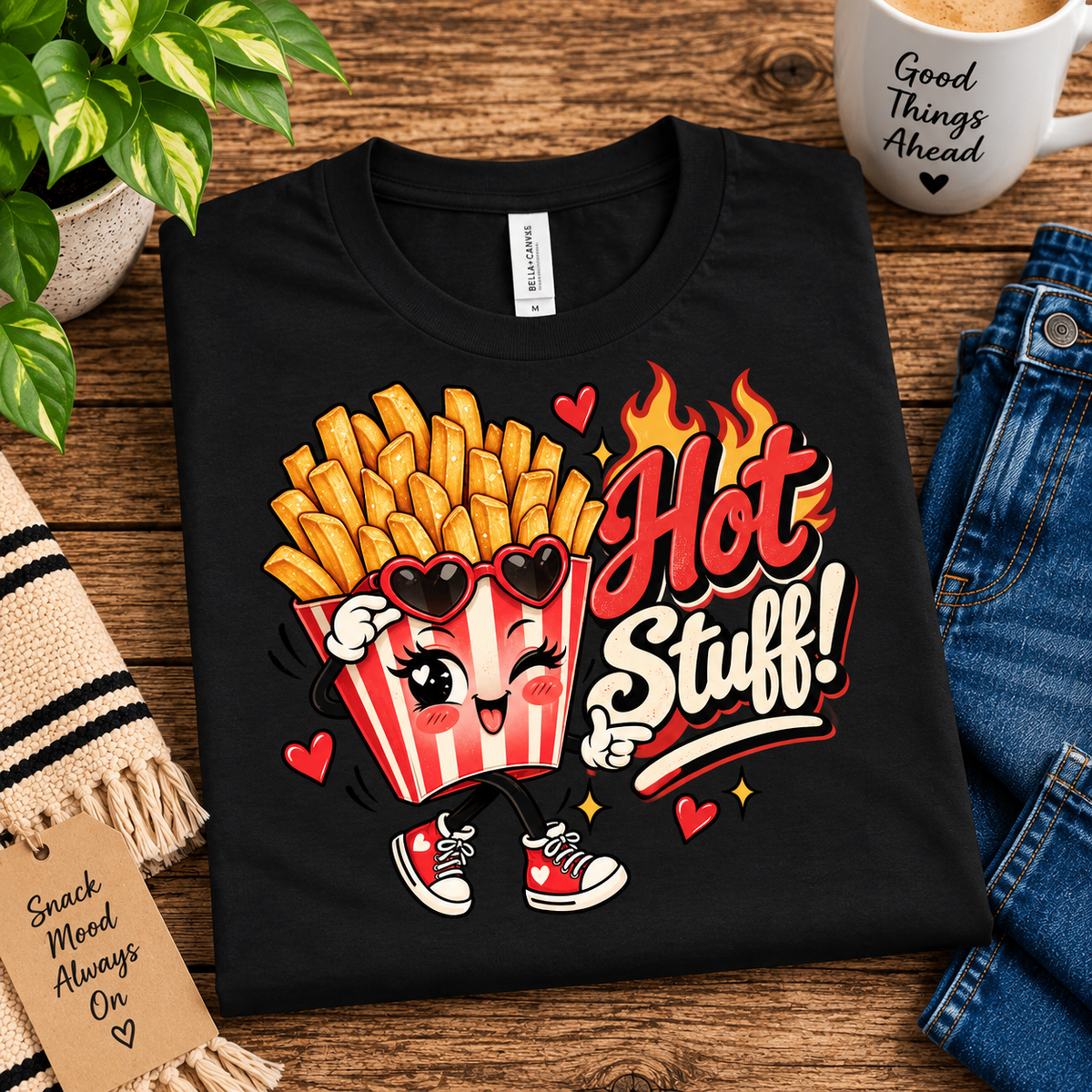 A folded mockup of Hot Stuff retro food graphic t-shirt in vintage black