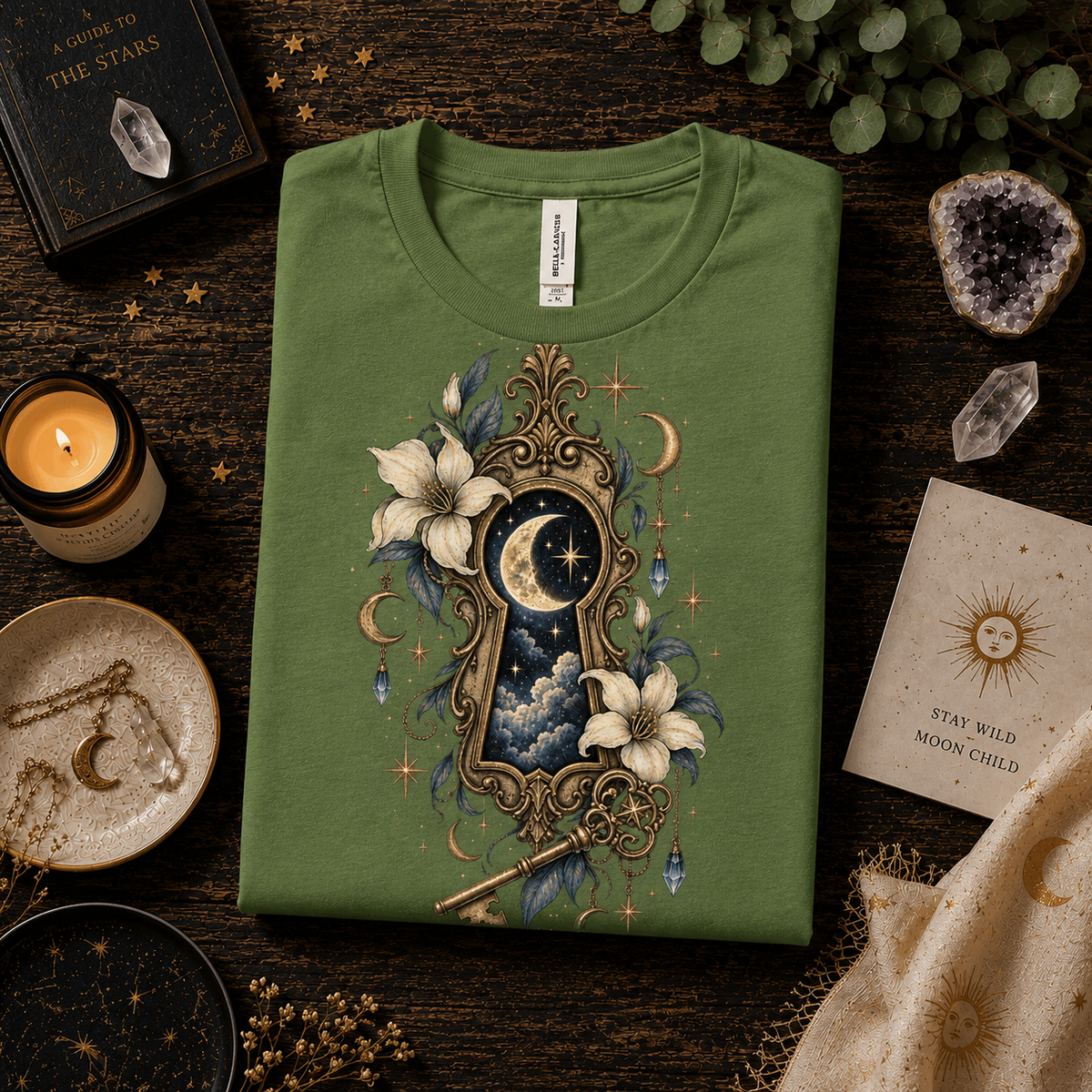 A folded mockup of Cosmic Keyhole celestial graphic t-shirt in leaf.