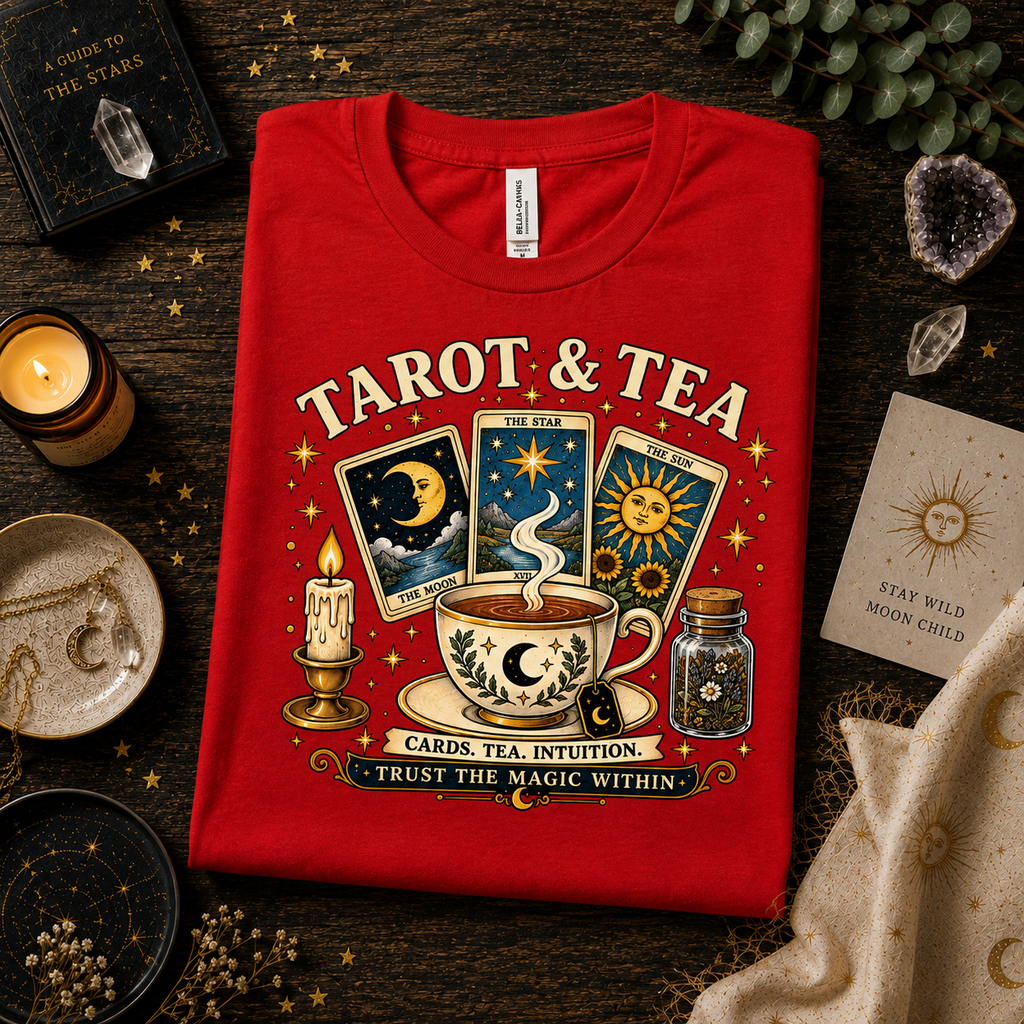 A folded mockup of Tarot & Tea celestial graphic t-shirt in red.