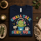 A folded mockup of Small Talk Survivor cute nature graphic t-shirt in navy.