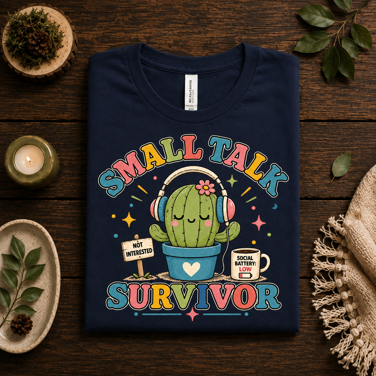 A folded mockup of Small Talk Survivor cute nature graphic t-shirt in navy.