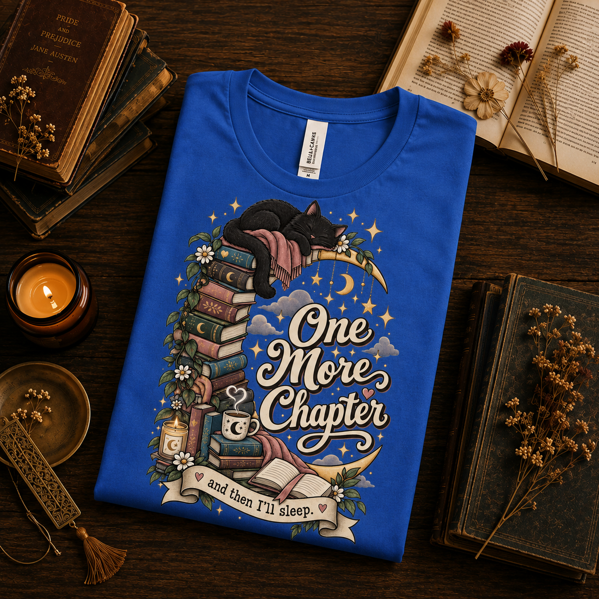 A folded mockup of One More Chapter cute book graphic t-shirt in true royal.