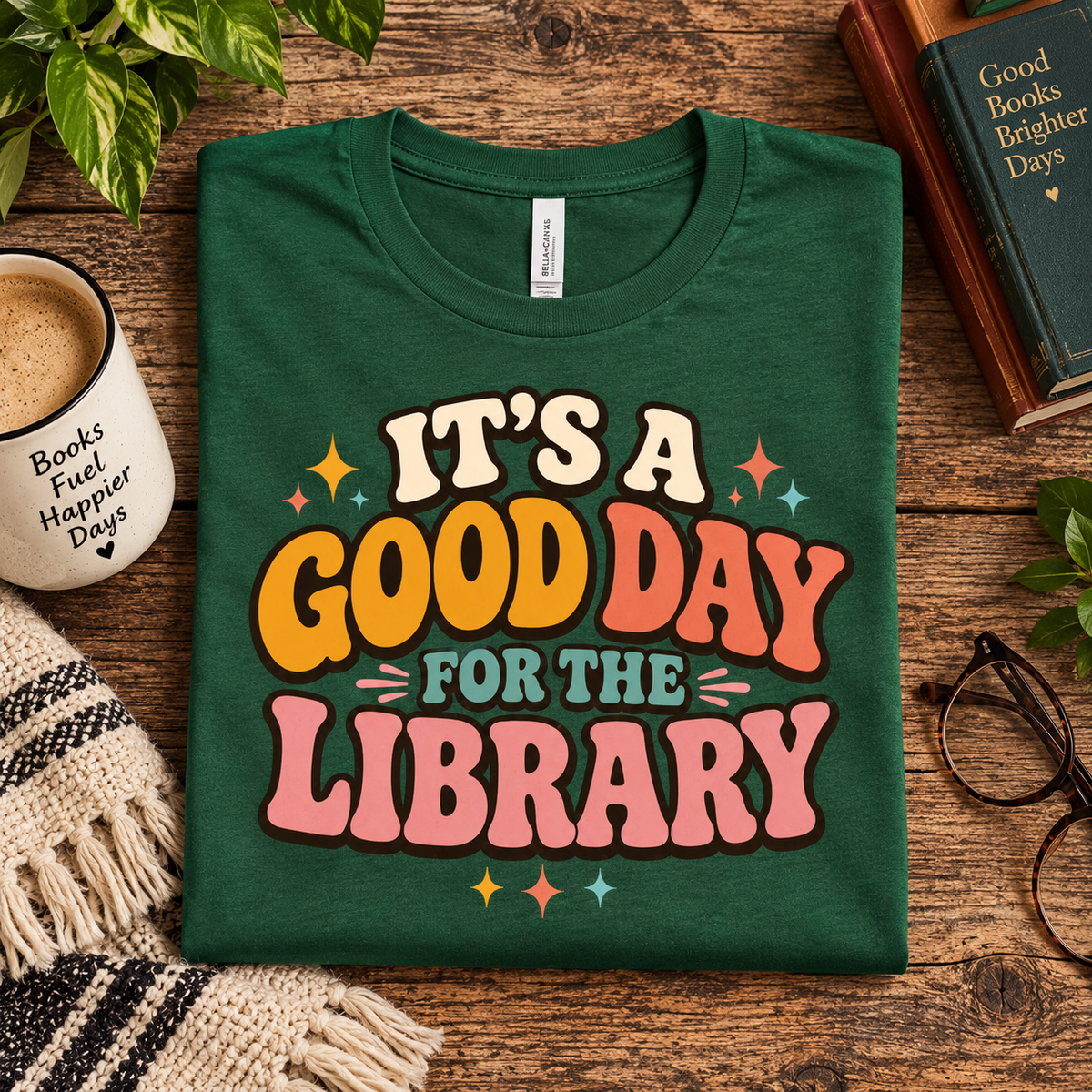 A folded mockup of It's A Good Day funny book graphic t-shirt in evergreen.