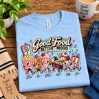 A folded mockup Good Food retro food graphic t-shirt in baby blue.